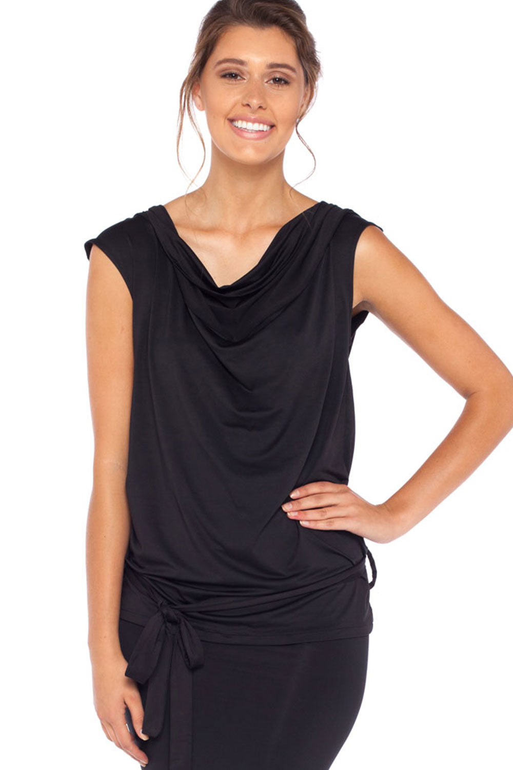 A woman wears a black, sleeveless hooded top with cowl neck. Designed by Australian leisurewear brand, Urban Silk, this hoodie top is comfortable for travel and casual wear. While it's slinky fabric makes for an elegant black evening top for women. Shop in Urban Silk Australia's online fashion boutique.