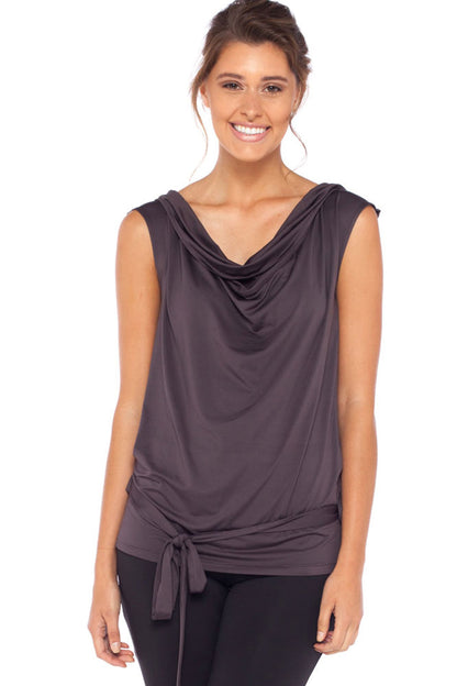 A woman wears a sleeveless hoodie top in grey slinky jersey. Great for leisurewear luxe, this slinky hooded top drapes to fit women looking for petite to plus size leisurewear. Shop hoodie tops online at Australian fashion boutique Urban Silk clothing.