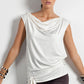 A woman wears a sleeveless hoodie top in ivory slinky jersey. Styled as a summer top, this lightweight casual top makes a good travel top for holiday capsule wardrobes. In comfortable stretch jersey, it's a great top for plus size and curvy women. Shop online at Australian leisurewear brand, Urban Silk's online clothes boutique!