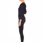 Side view of a woman wearing a long sleeve hoodie top in black slinky jersey. The hoodie sweatshirt is worn with black legging pants. Both hoodie top and legging pants are by Australian fashion brand, Urban Silk who specialise in leisurewear clothing women can wear for work, travel and casual wear. Shop women's leisurewear  online in petite to plus sizes.