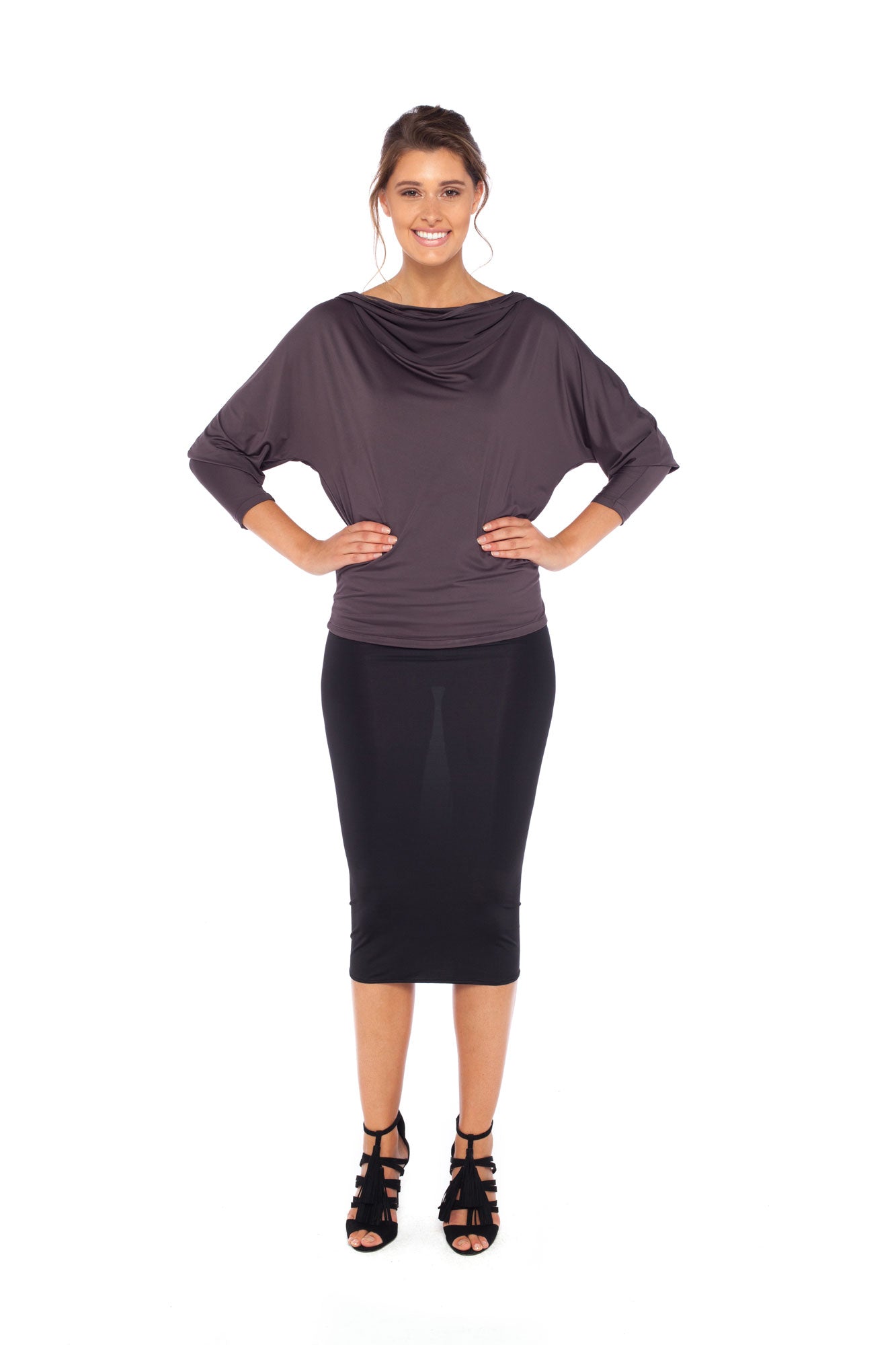 Woman wearing a hooded top in slinky jersey with jersey cylinder-cut black pencil skirt and styled with heels for work wear clothing or low-key going out style. Designed in Australia and made for petite to plus size women