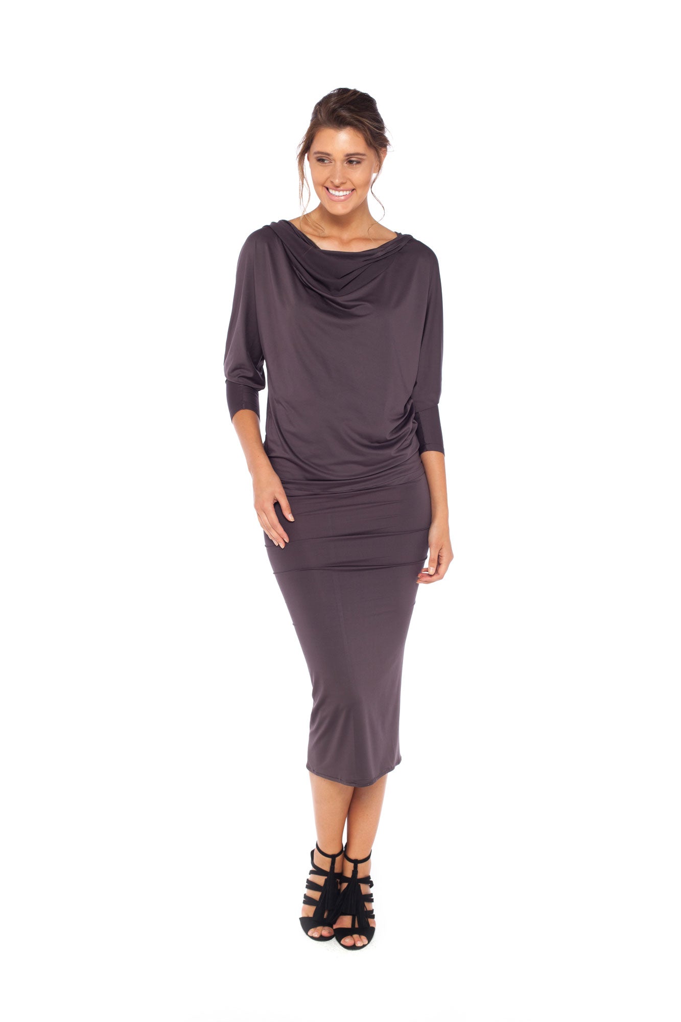 Woman wearing a hooded top in slinky jersey with batwing sleeves worn with a cylinder-shape pencil skirt and styled with heels for work wear style or low-key going out style. Designed in Australia and made for petite to plus size women