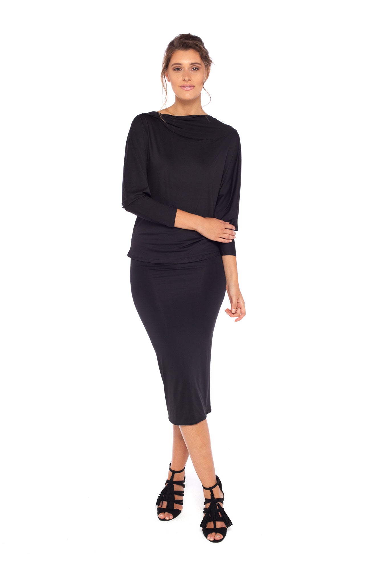 Woman wearing black jersey hooded top with batwing sleeves worn with black cylinder-shape pencil skirt and styled with heels for work style or low-key evening glamour. shop jersey tops and skirts designed in Australia for petite to plus size women.