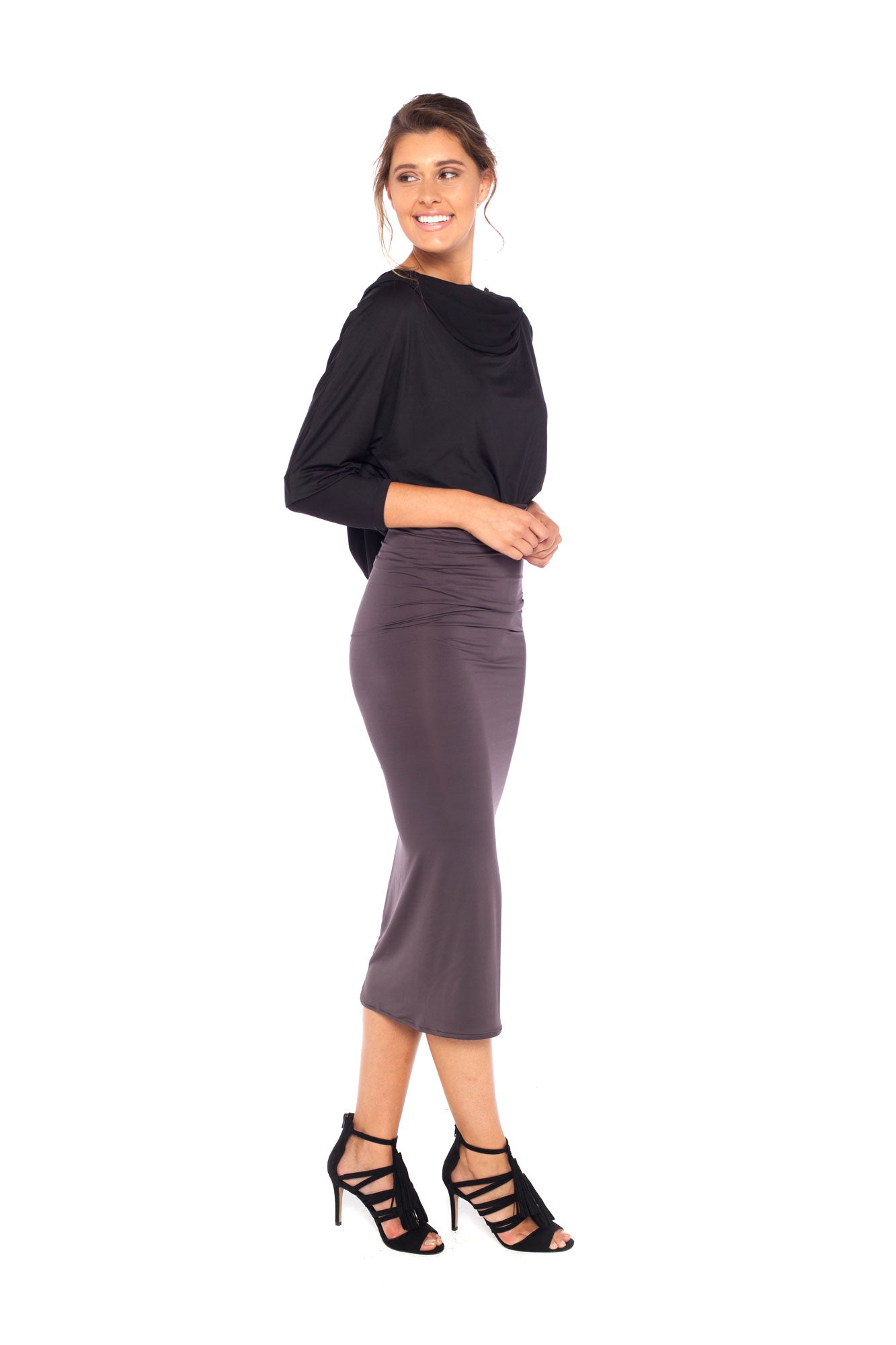 Woman wearing black jersey hooded top with batwing sleeves worn tucked into cylinder-shaped pencil skirt in Donkey and heels for a work wear look or going out style. Designed in Australia for petite to plus size women.