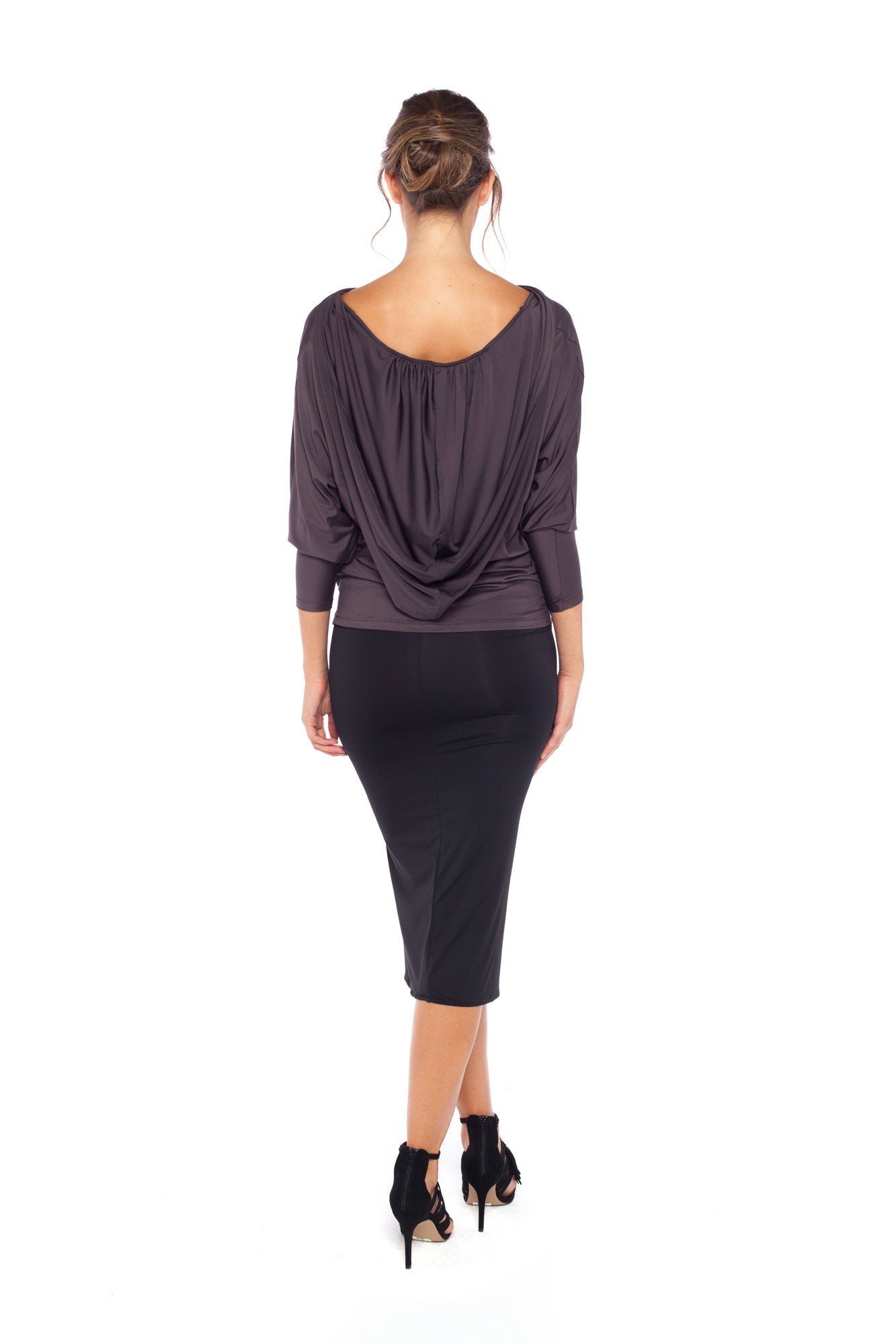 Woman wearing a hooded top in slinky jersey with jersey cylinder-cut black pencil skirt and styled with heels for work wear clothing or low-key going out style. Designed in Australia and made for petite to plus size women