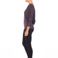 Woman wearing a hooded top in slinky jersey with batwing sleeves worn with slim-leg, long-length, black legging trousers and styled with heels for work wear style or low-key going out style. Designed in Australia and made for petite to plus size women